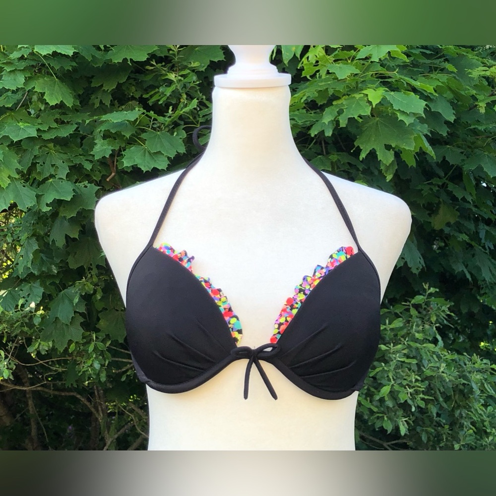 Victoria’s Secret bikini top. Black with bright patterned ruffled trim size 34B
